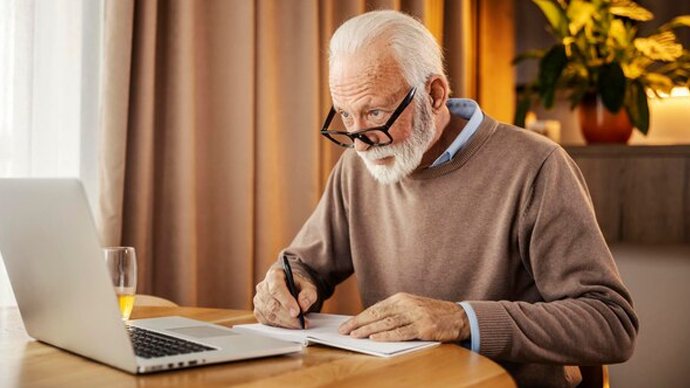 Older man taking an online course for self-education
