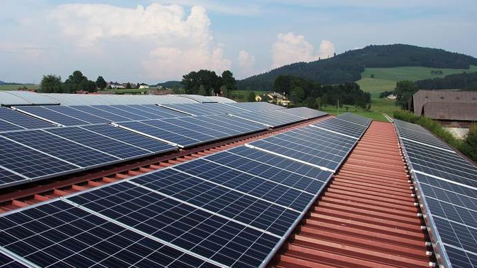 Solar panels on rooftops, highlighting the shift to sustainable energy for a cleaner future